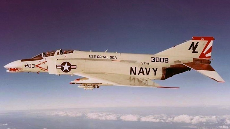 A F-4 Phantom II flying high over the clouds