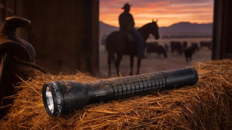 Maglite ML150LRX on hay bale with silhouette of man on horse in background