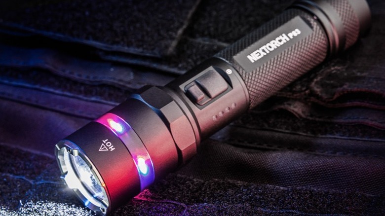 Nextorch P83 2,100-lumen Rechargeable Flashlight on fabric