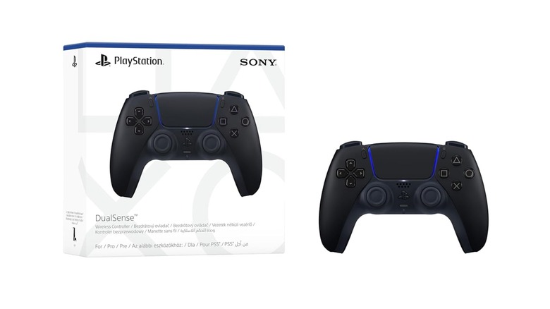 A PlayStation DualSense controller on display next to its box