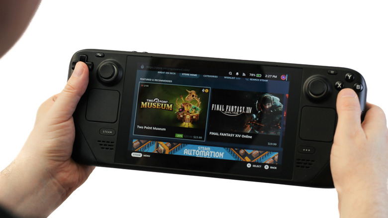 A Steam Deck showing its store page while being held by a person