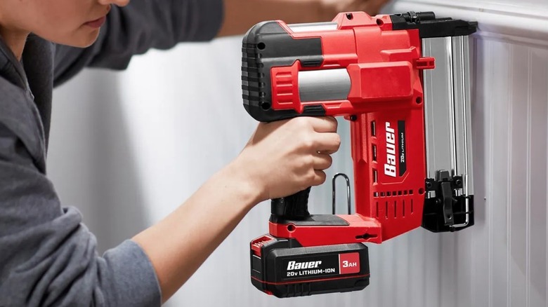 Person using a Bauer brad nailer