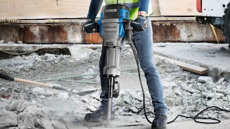 Person using a Hercules hex break hammer