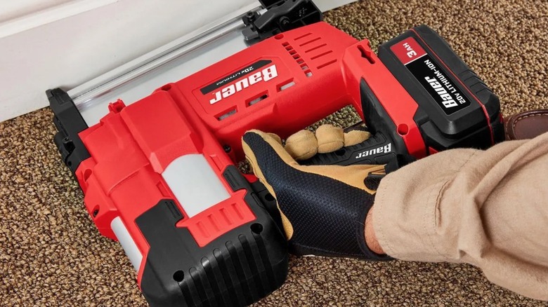 Person using a Bauer Brad Nailer