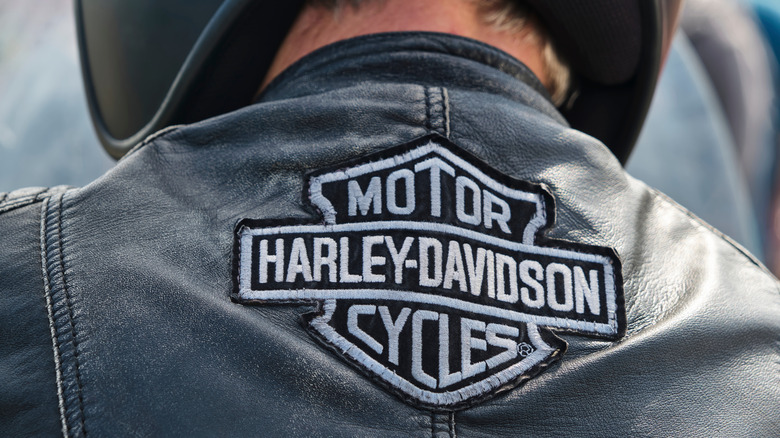 Black leather jacket with the Harley-Davidson logo patch at the center