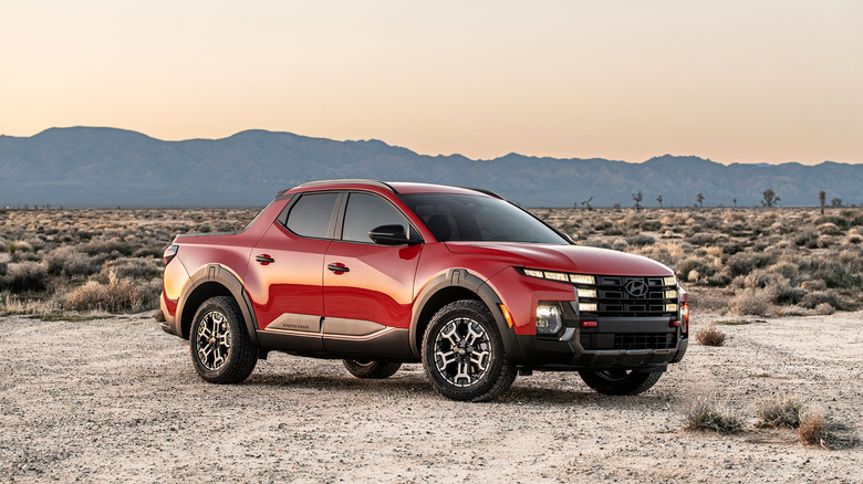 A side on shot of a red 2026 Hyundai Santa Cruz XRT parked