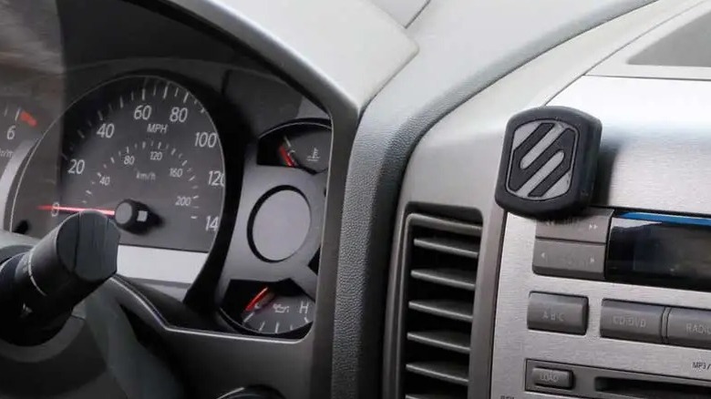 Scosche car mount above CD player