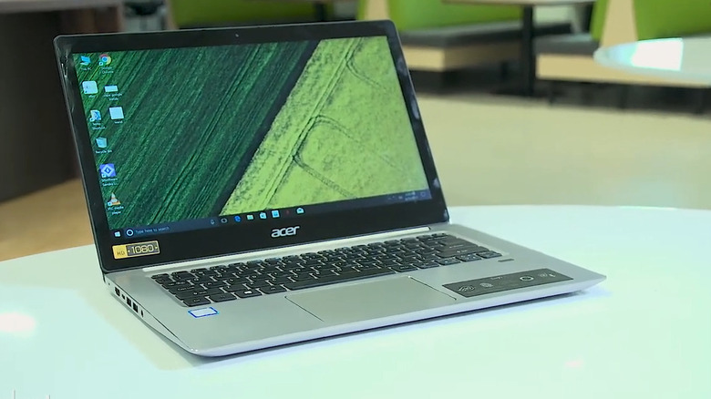 Acer laptop on white table