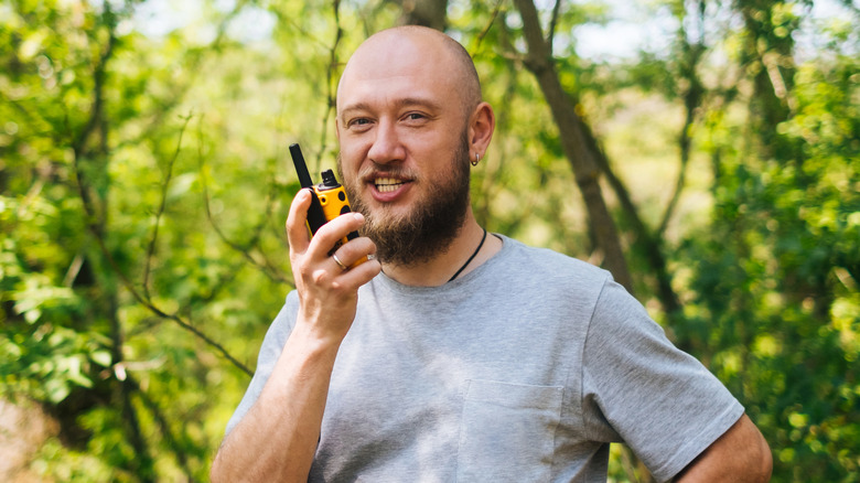 Man holding walkie-talkie