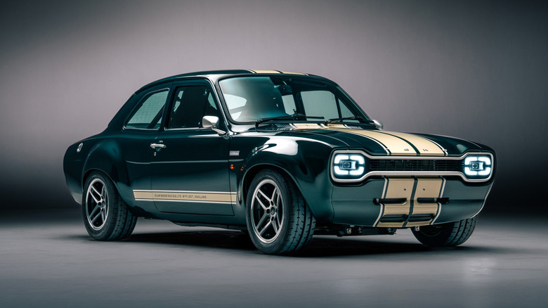 A green Boreham Motorworks Mk1 RS restomod car parked in a studio.
