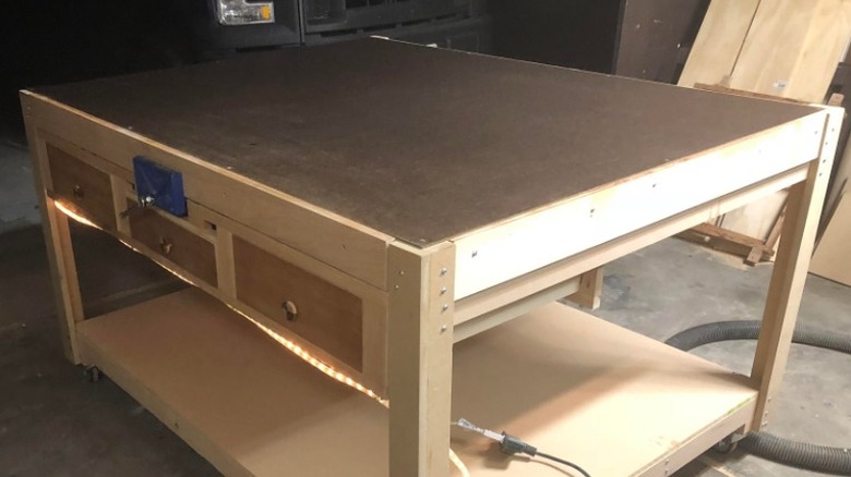 Workbench with hardboard top over MDF in garage