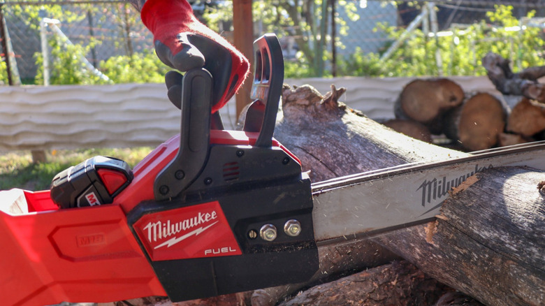 Milwaukee chainsaw and glove