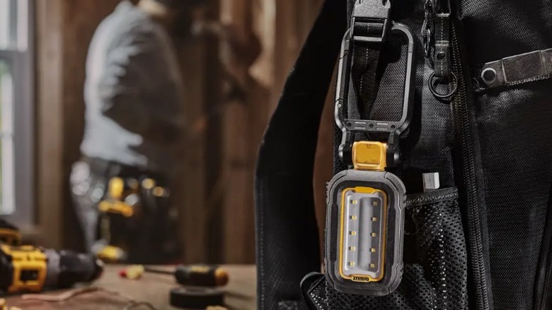 DeWalt Rechargeable Task Light clipped to backpack