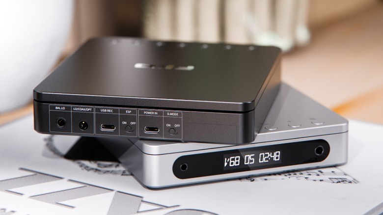 Black and silver FiiO DM13 CD players stacked on top of one another.