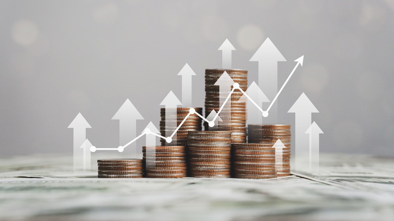 stack of coins and financial chart