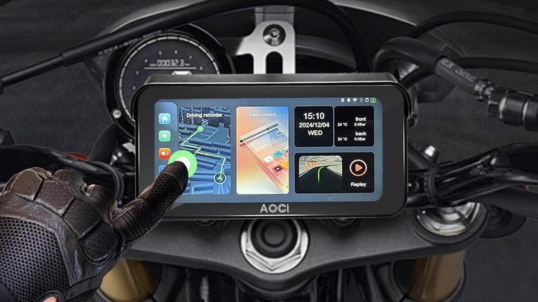 The Aoocci Apple CarPlay display mounted on a motorcycle