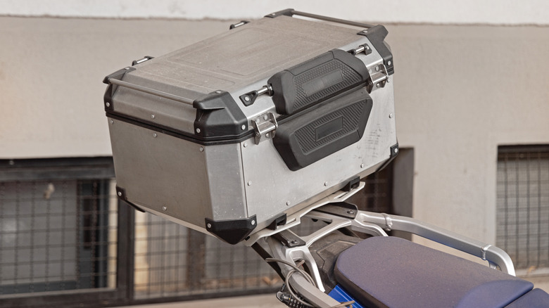 Aluminum top box attached to the back of a motorcycle
