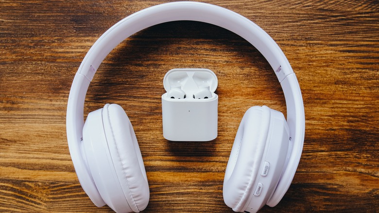 White bluetooth headphone and earbuds