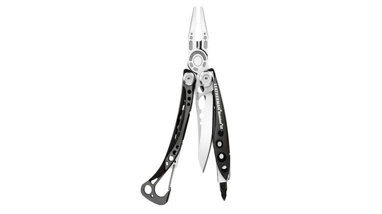 Silver and black Leatherman Skeletool CX with pliers out on a white background