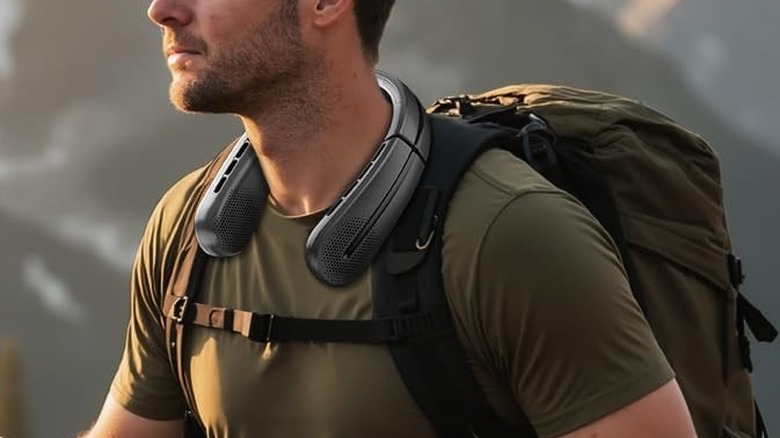 man wearing neck fan
