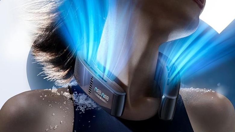woman using neck fan