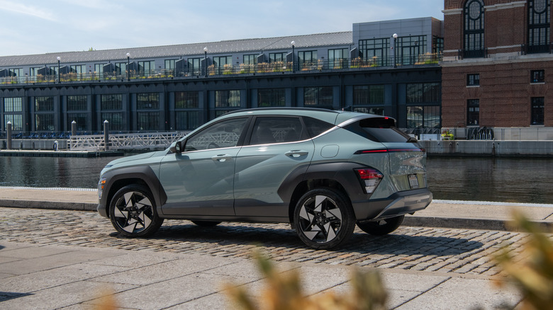 2026 Hyundai Kona parked on cobblestone road, left-side view