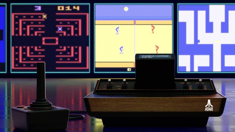 The Atari 2600+ and its controller in front of screenshots of Atari 2600 games