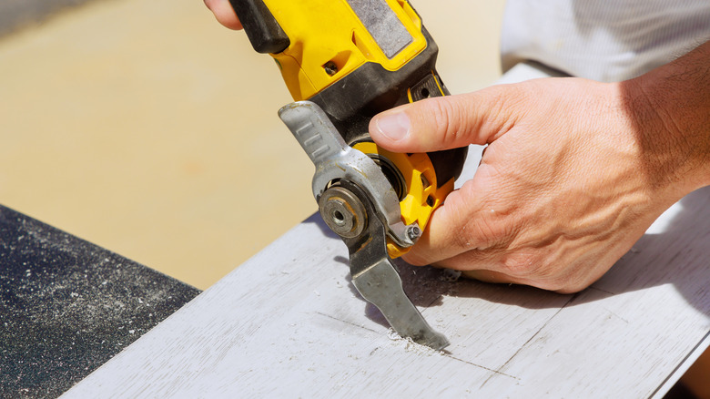making a cut with a multi-tool