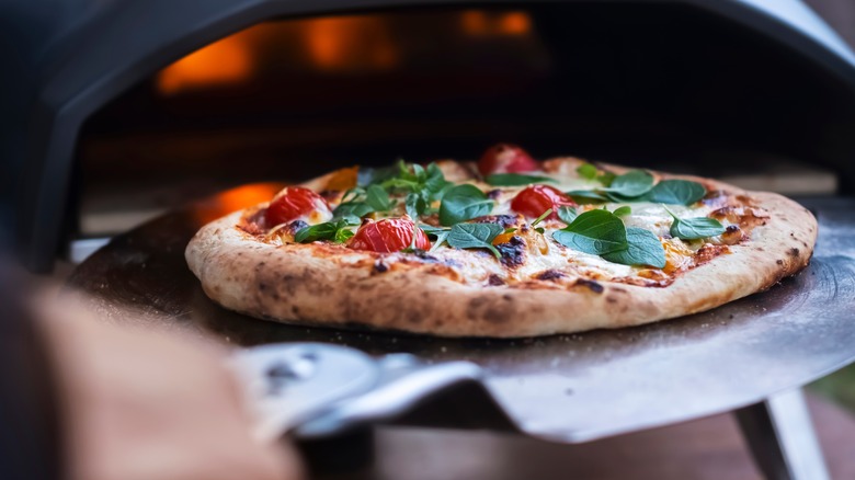 man holding pizza pan