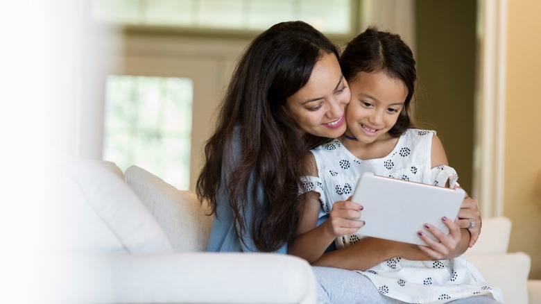 Mother and a daughter using a tablet