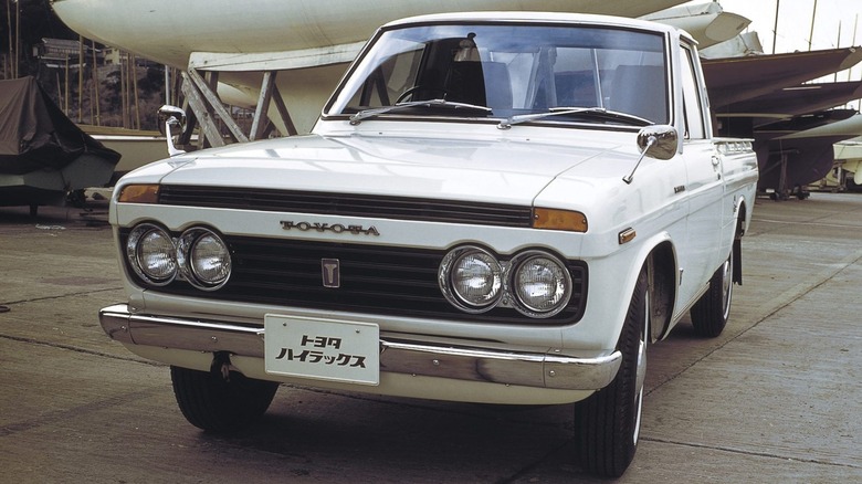 A first generation Toyota Hilux in white color