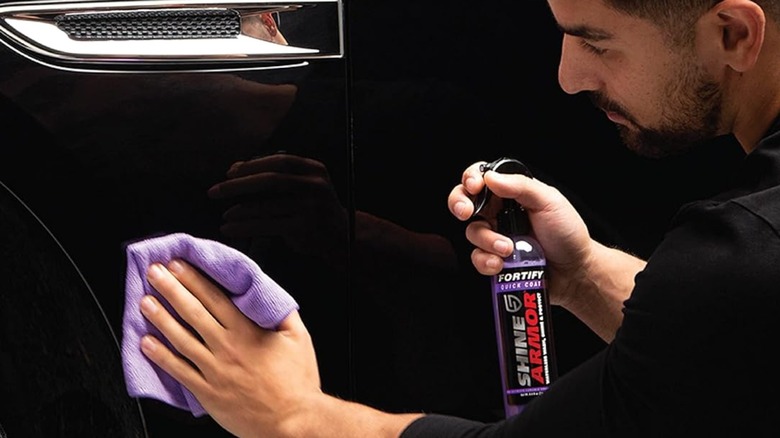 Man using Shine Armor Fortify Quick Coat spray