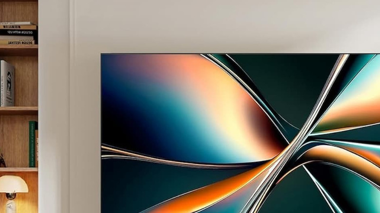 Hisense 55 inch TV on the wall, above a soundbar.