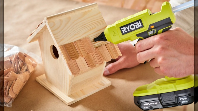 Ryobi 18V One+ Glue Gun in use on a birdhouse