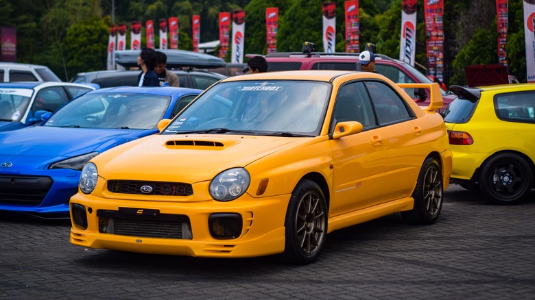 Yellow Subaru Impreza parked
