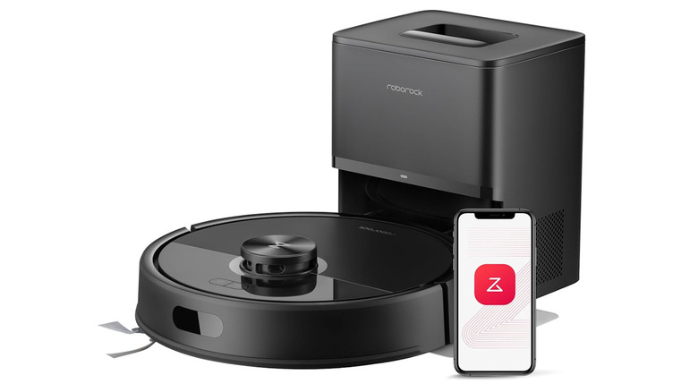 Roborock vacuum in the charging station with a smartphone in front with the Roborock logo