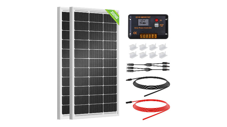 Two solar panels with charge controller and other accessories on a white background
