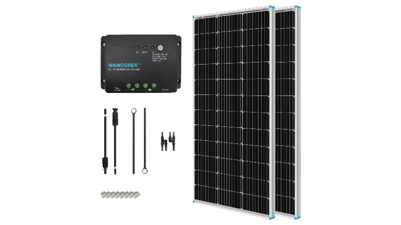 Two solar panels, a charge controller, and mounting brackets on a white background