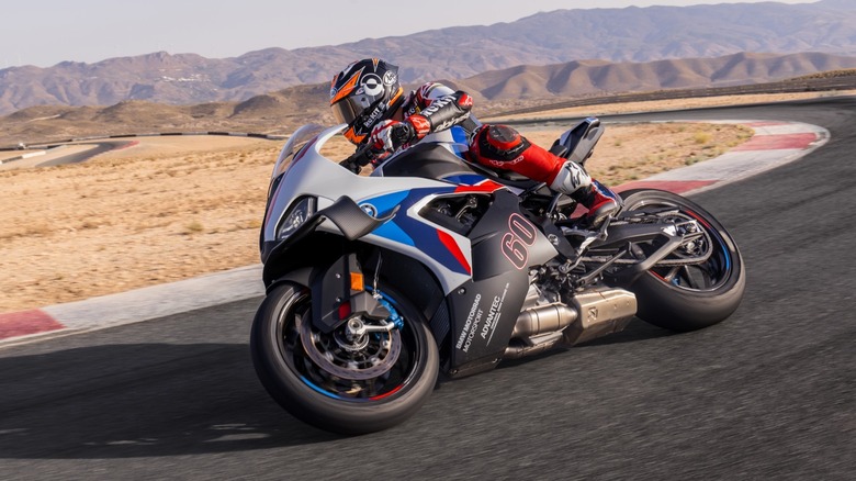 2025 BMW M 1000 RR cornering on track front 3/4 view