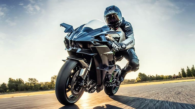 front view of a rider in a closed track with a Kawasaki H2R