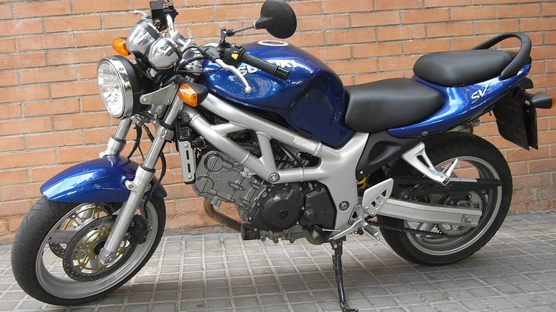 side profile view of a blue Suzuki SV650