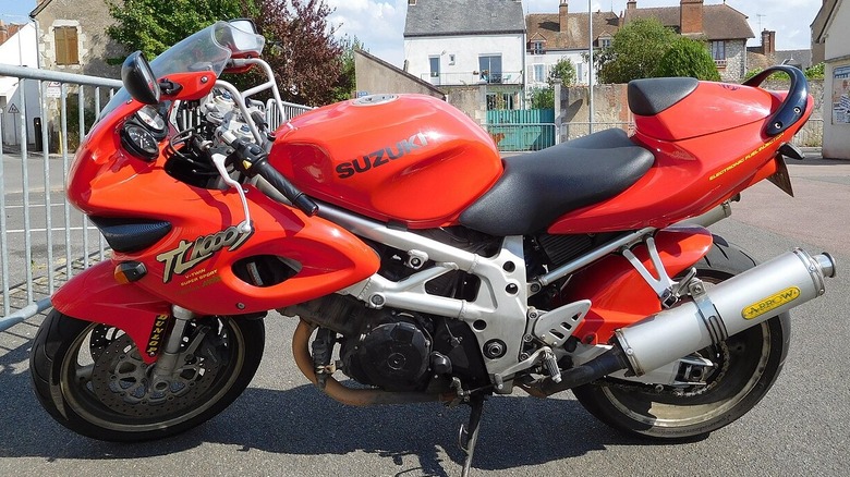 side view of a red Suzuki TL1000S V-Twin Sportbike on display
