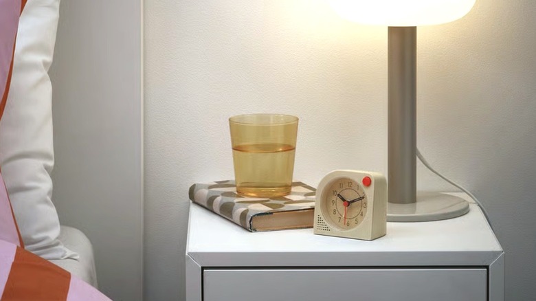 Tjinga alarm clock resting on a night stand