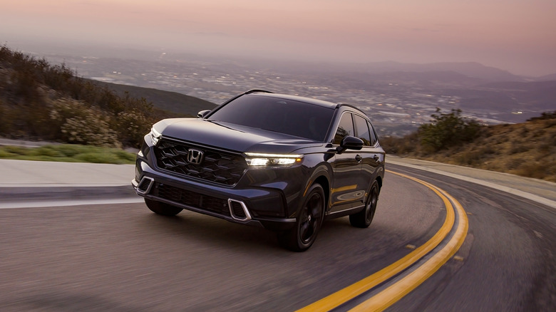A blue 2025 Honda CR-V driving