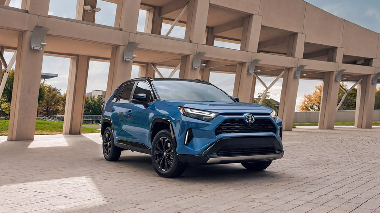 A blue 2025 Toyota RAV4 parked
