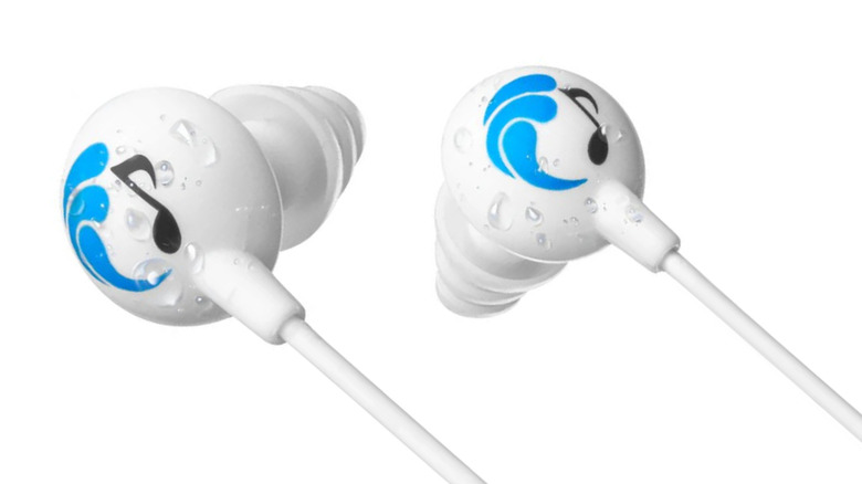 Close up of Underwater Audio Swimbuds ear buds with tree-shaped earbud tips. The two earbuds have a logo depicting a blue wave and a black musical note.