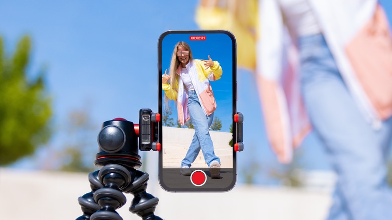 girl filming with phone