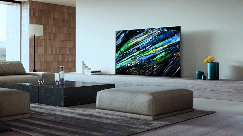 A Sony Bravia A95L on display in a living room.