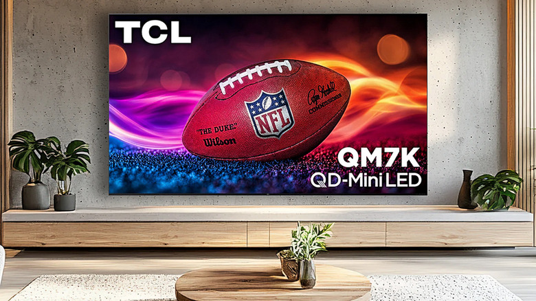 A TCL QM7K with an NFL football displayed on the screen.