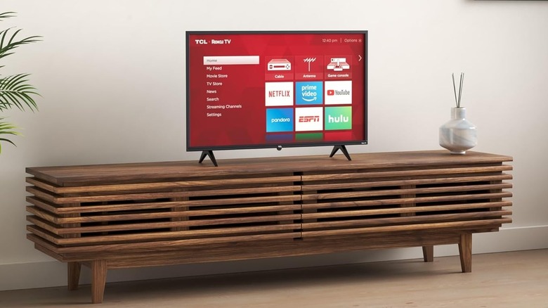 A TCL 3-Series S325 TV on display in a living room.